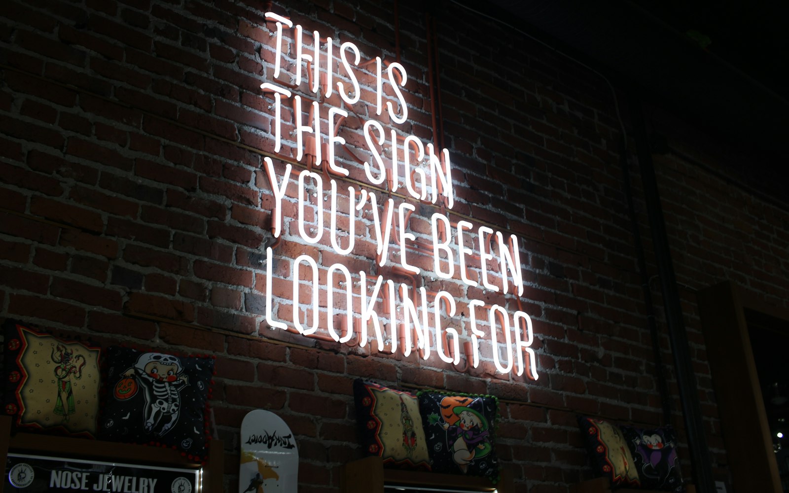 White neon sign reading This is the sign you have been looking for