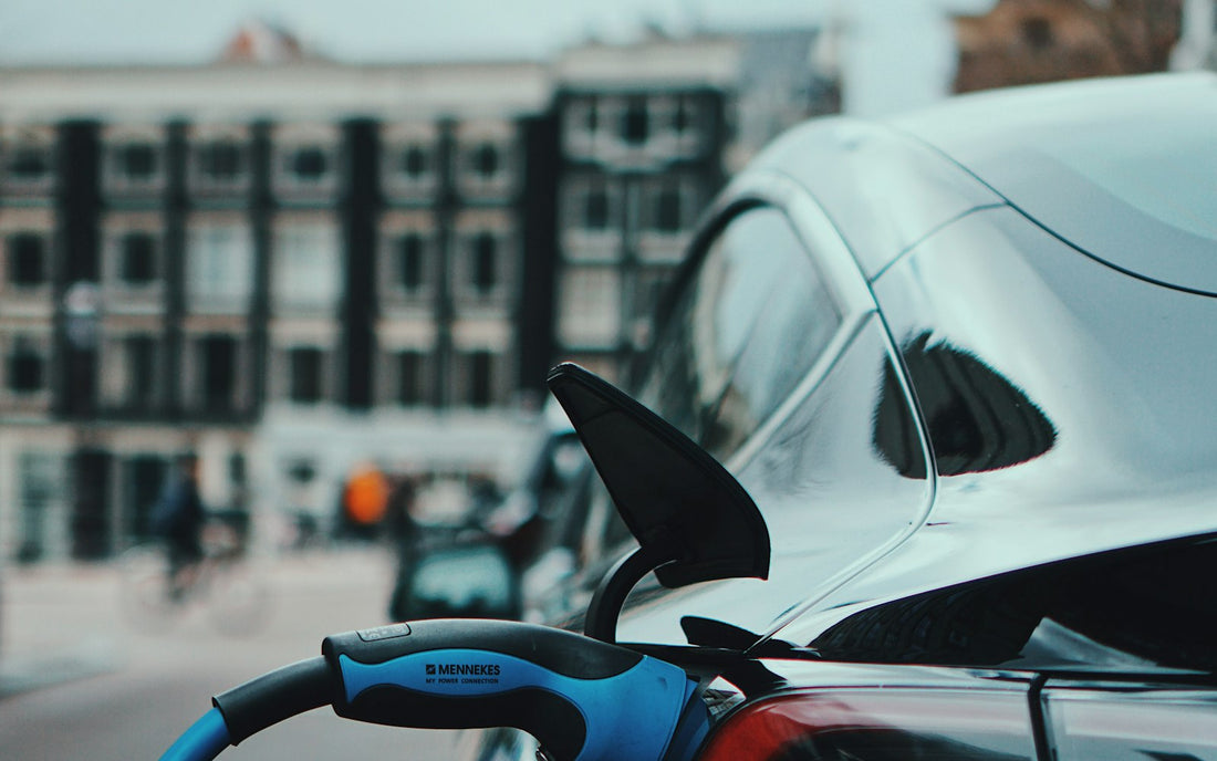Electric car charging on a city street